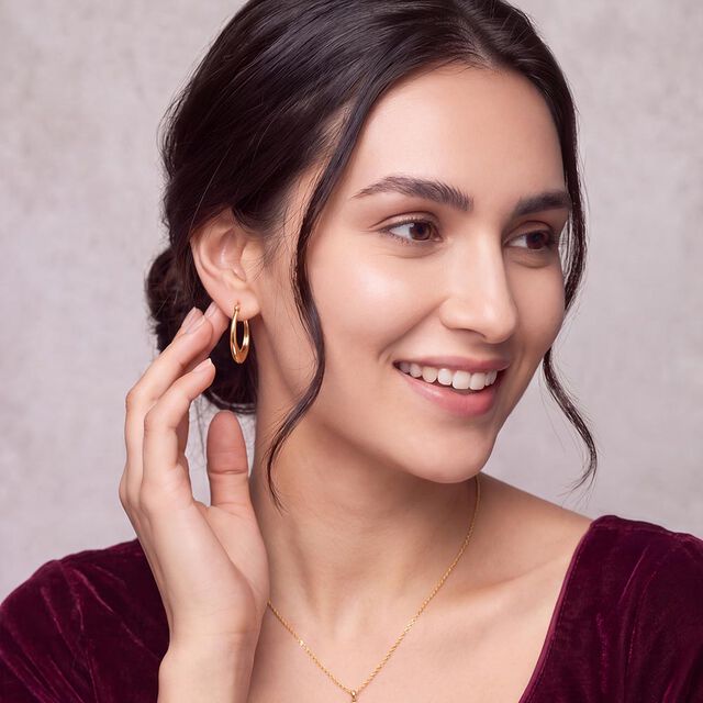 Tanishq Golden Crescent Oval Hoop Earrings for Women 